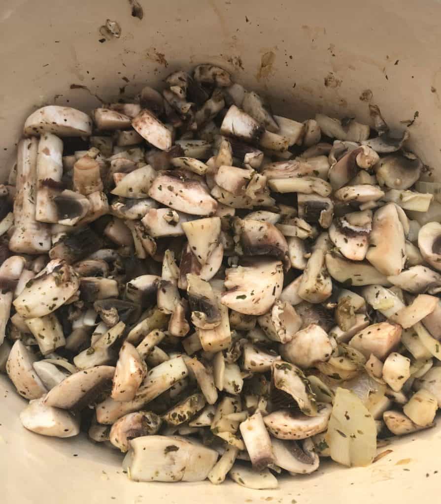 diced mushrooms oregano and garlic in a pan