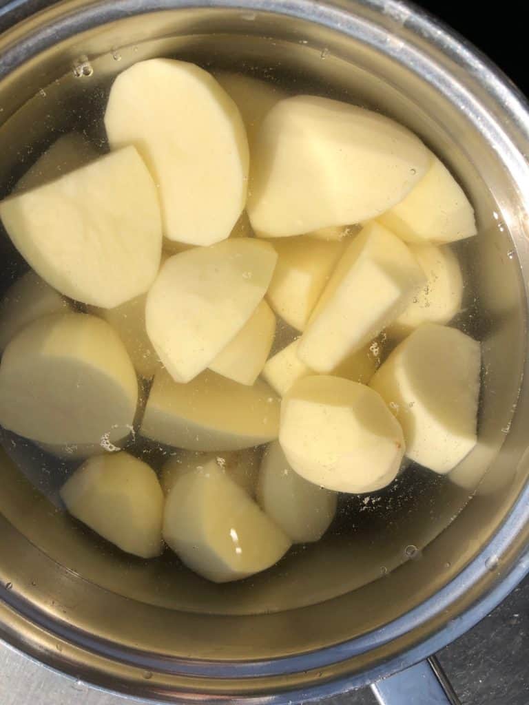 peeled potatoes in a pan
