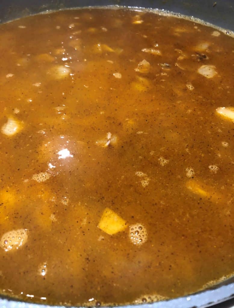 rice onion curry powder simmering