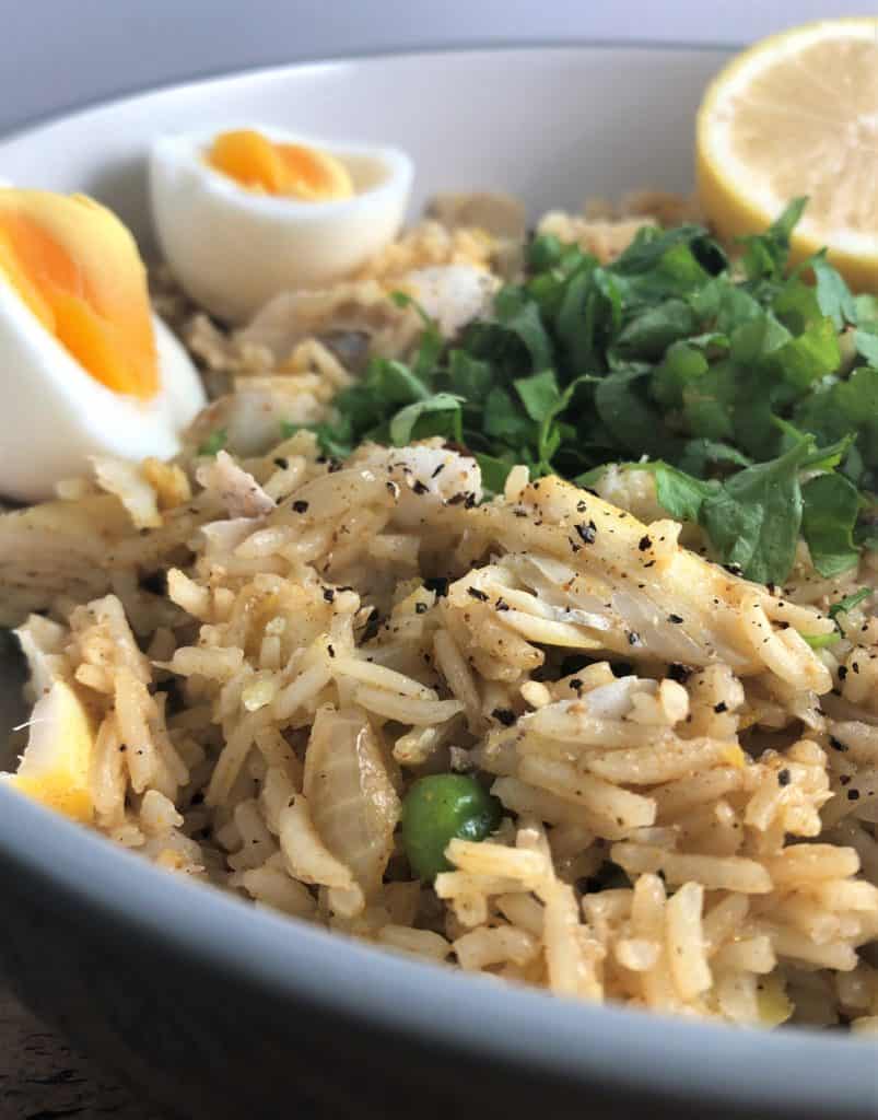 Simple Kedgeree with Smoked Haddock egg and sliced lemon in bowl