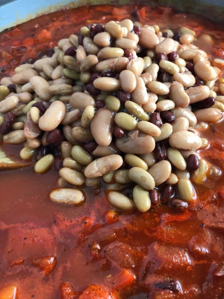 spicy bean goulash with mixed beans in pan