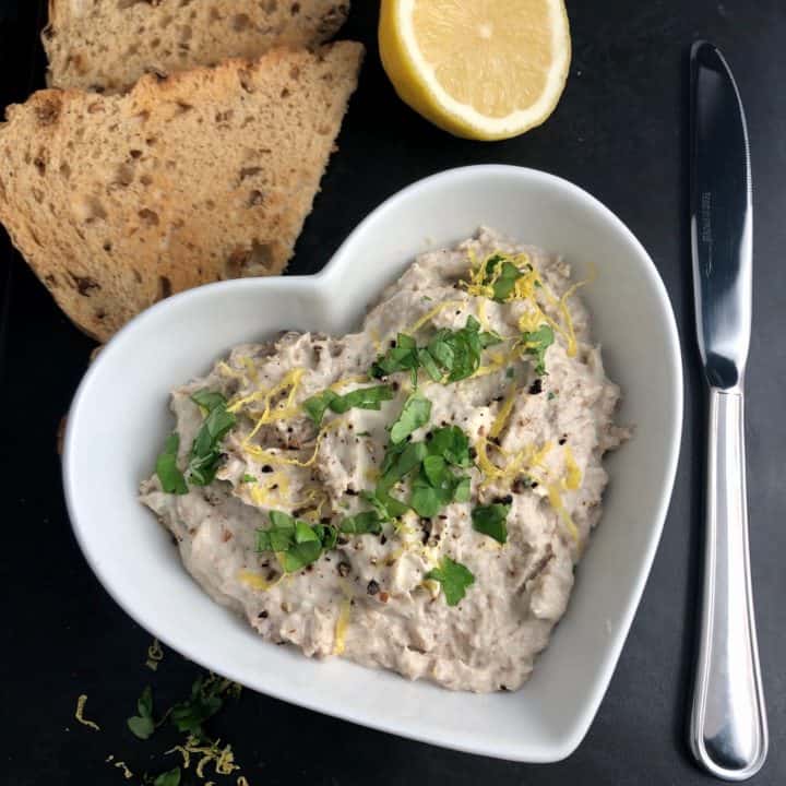 simple smoked mackerel pate in bowel on board with toast lemon half and knife