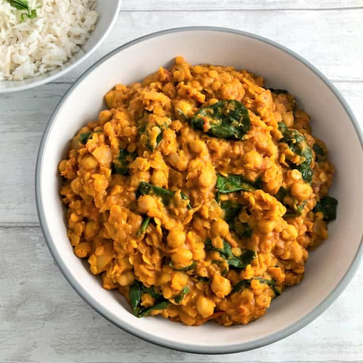 Chickpea Lentil and Spinach curry with rice in background
