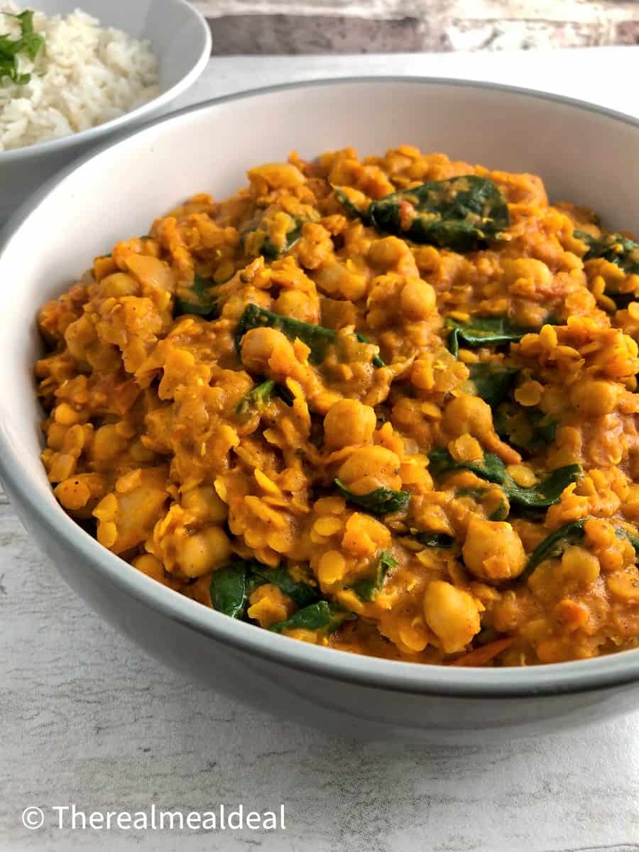 Chickpea Lentil and Spinach curry with rice in background