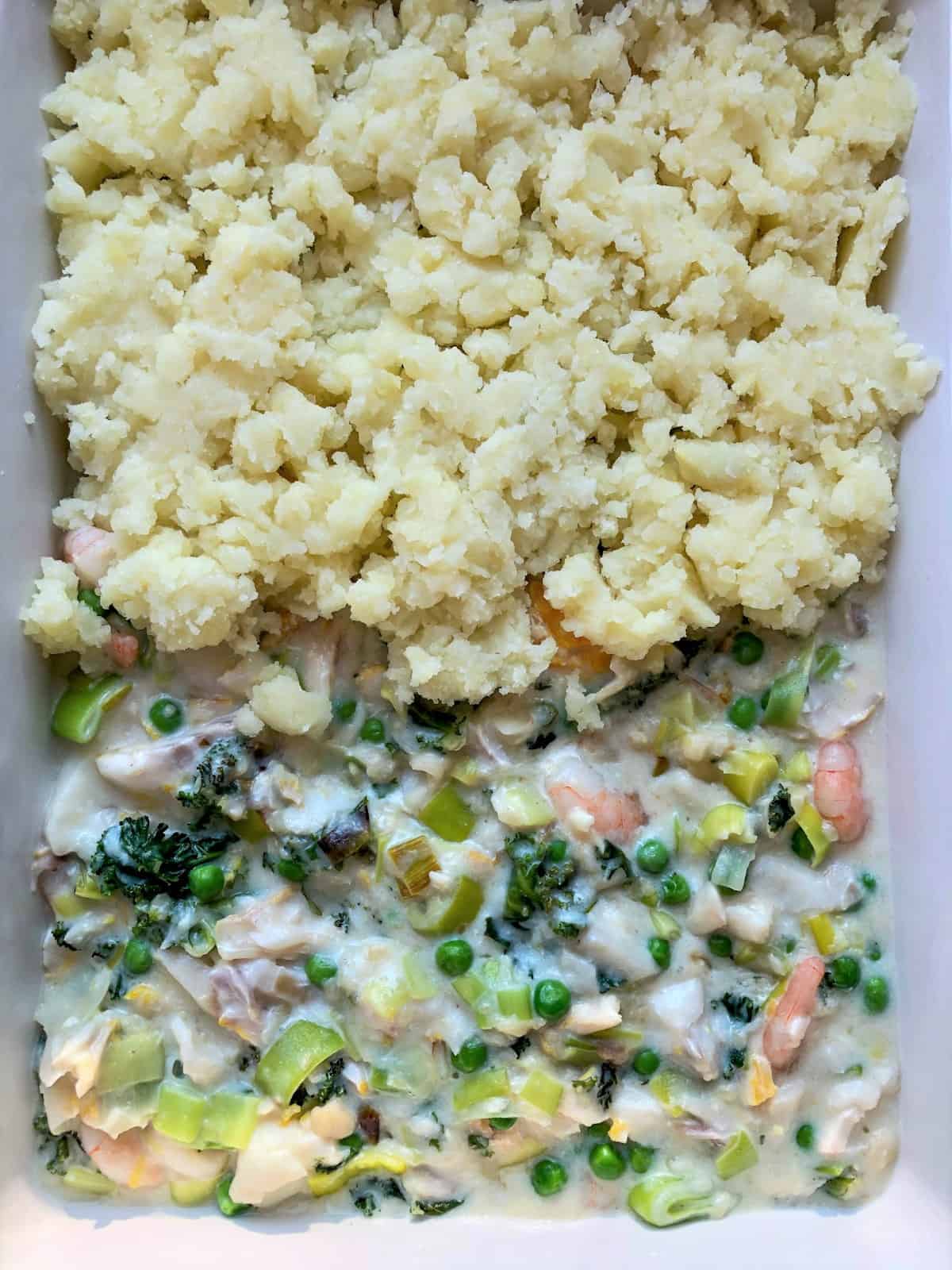 fish pie with leeks with mash added over half of pie
