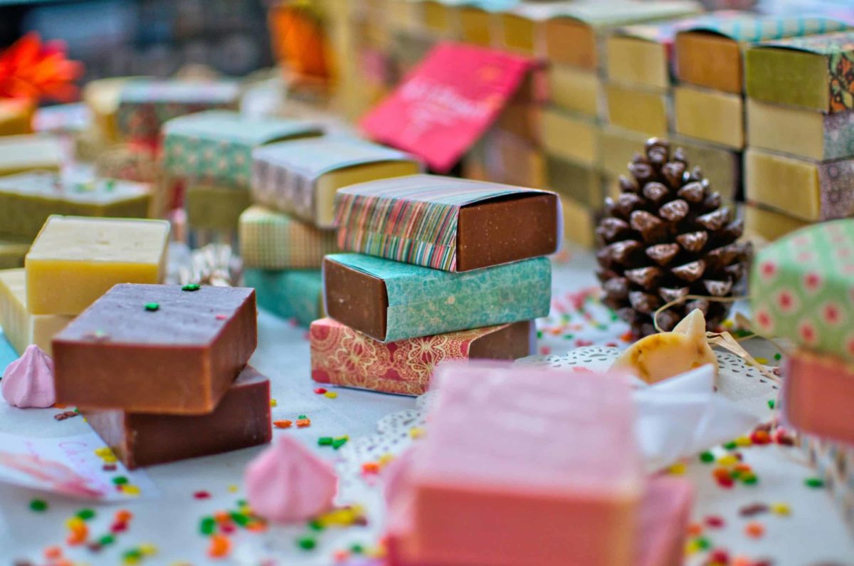 selection coloured handmade soaps wrapped in paper