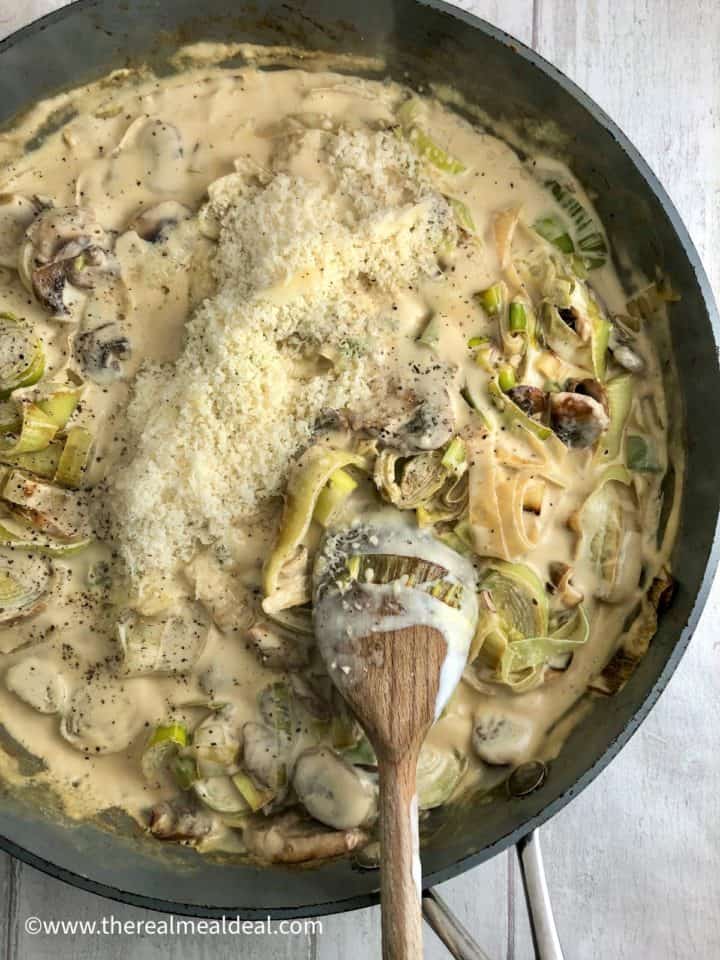 grated parmesan cheese added to cream sauce with leeks and mushrooms.