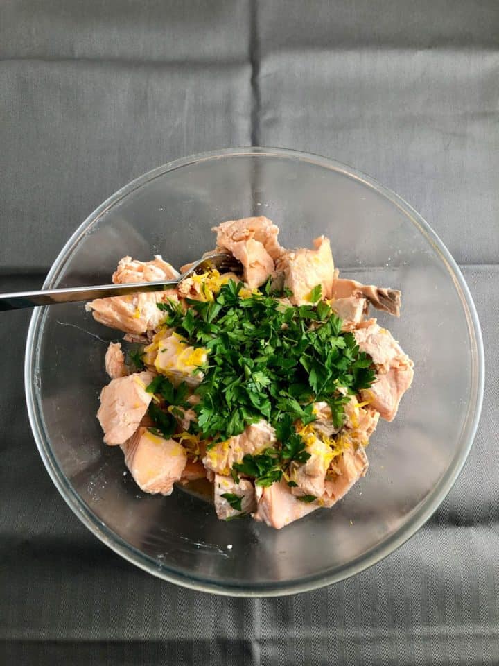salmon fresh parsley lemon juice and zest in a bowl.