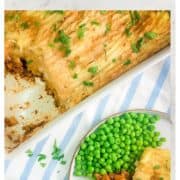 close up of quorn cottage pie on plate served with garden peas