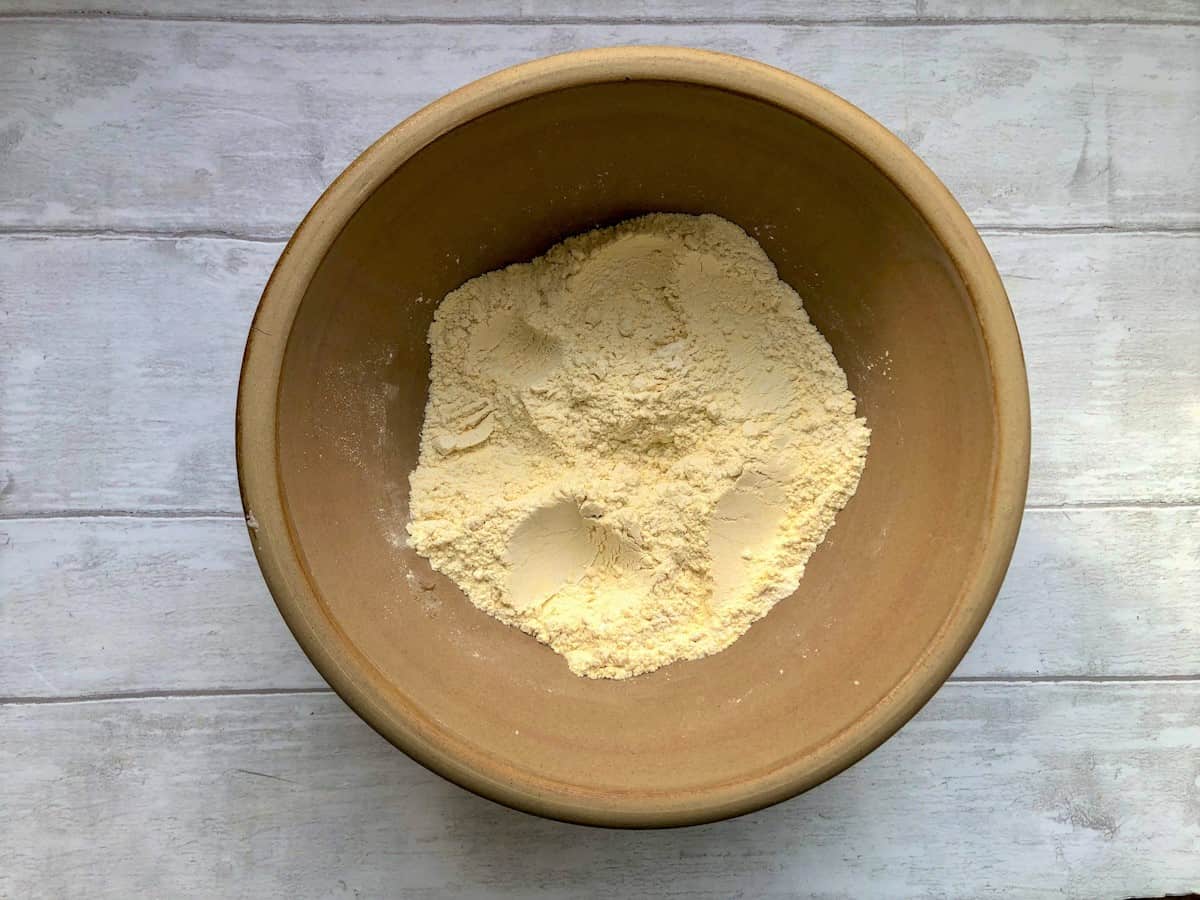 self raising flour garam flour and baking powder mixed together in a bowl.