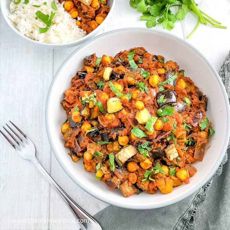 Aubergine and Chickpea Curry in bowl topped with coriander