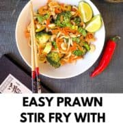 pinterest image prawn stir fry with noodles showing bowl of stir fry with chop sticks and cashew nuts
