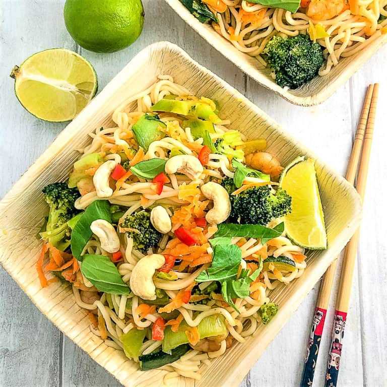 prawns with vegetable stir fry and noodles in square bowl with chopsticks